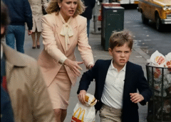 In the middle of the busy city street, no one paid attention to the little boy lying curled on a torn piece of cardboard near the sidewalk.